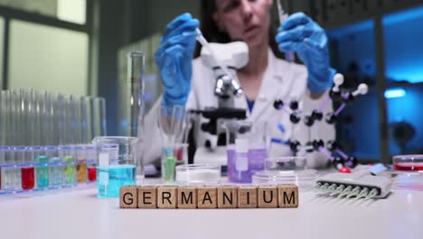scientist working in a laboratory with germanium element blocks