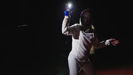 a female fencer in action during a fencing match