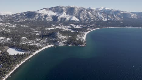 a high-flying, 4k drone shot over lake tahoe, california, during the winter season