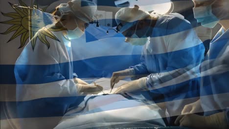 Animation-of-flag-of-uruguay-waving-over-surgeons-in-operating-theatre