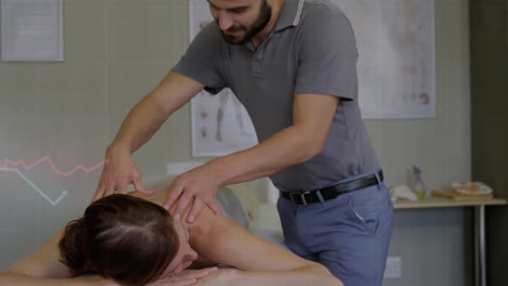 Animation-of-multiple-graphs-over-caucasian-male-masseur-giving-back-massage-to-woman