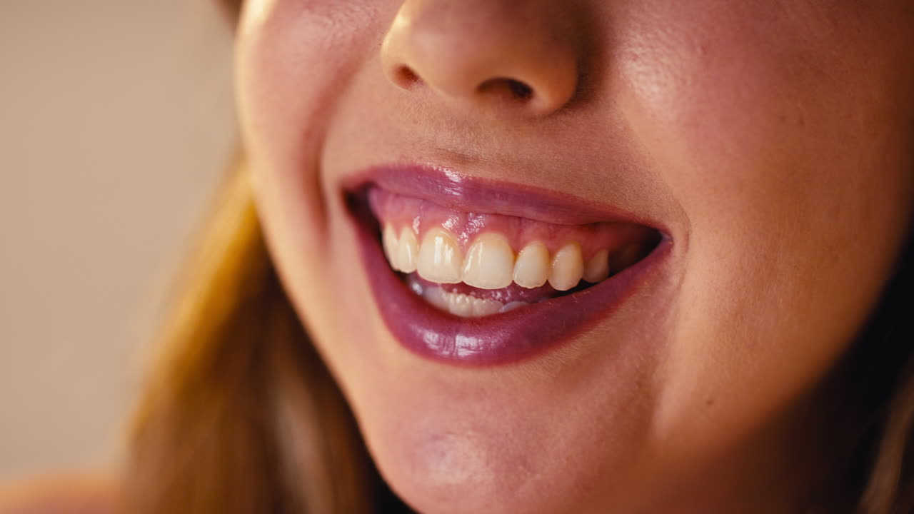 Studio Close Up Shot Of Laughing Woman's Mouth Promoting Body Positivity