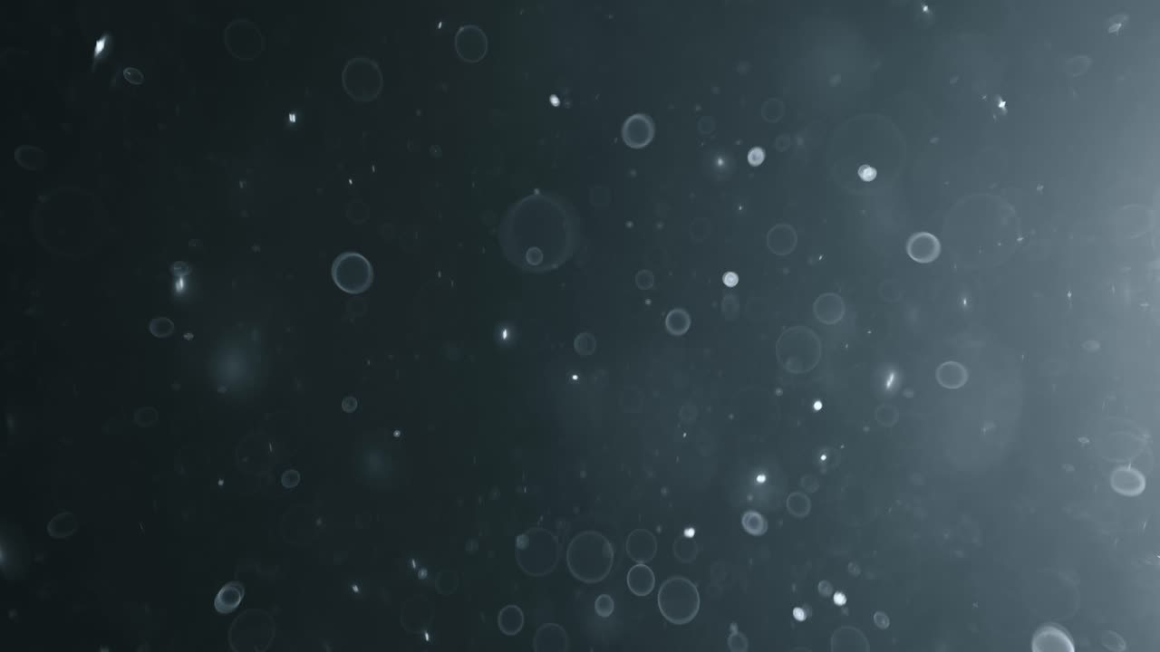 bokeh de partículas abstractas flotantes sobre fondo oscuro