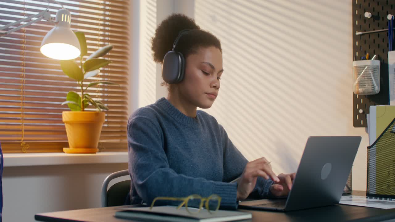 Young Woman Studying on Laptop