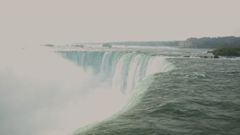 thick fog from cascading water from the river in niagara falls, ontario, canada - static shot