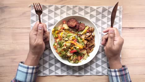 a plate of mixed vegetables with meatballs