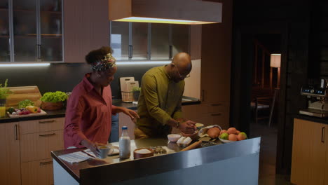 mature couple cooking in the kitchen