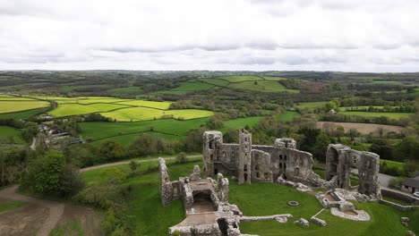 aerial forward over llawhaden castle ruins in pembrokeshire, wales