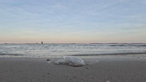 plastic waste littering a peaceful beachscape.