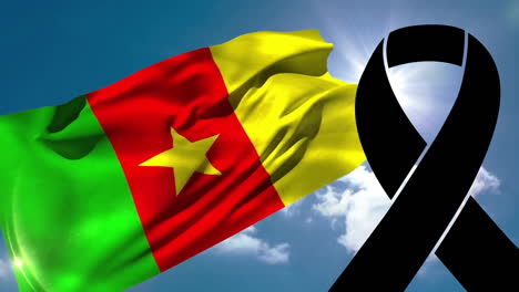 waving cameroon flag with large black ribbon for mourning or remembrance animation