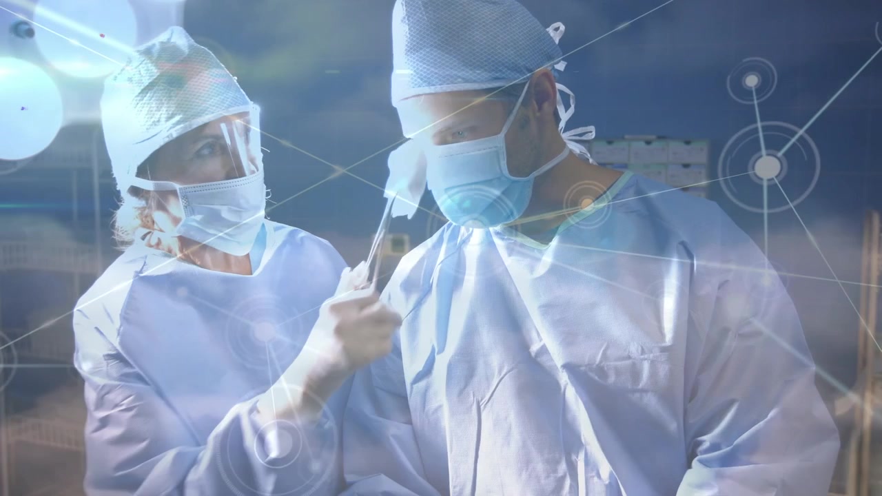 남성 외과 의사의 이마에서 땀을 닦아주는 여성 외과 의사를 배경으로 한 연결망