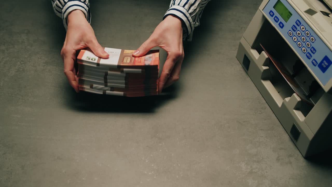 Specialised police officer Counting dollar banknotes in crime lab, conceptual image. High quality 4k footage