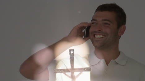 talking on phone, man with crucifix animation overlay in foreground
