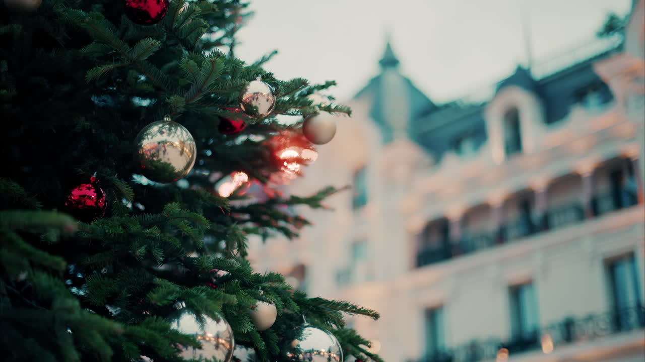 Close up of decorations on a Christmas tree in front of the Monte Carlo Casino in Monaco