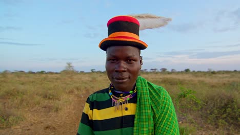 a karamojong man smiling at the camera in uganda, africa - close up