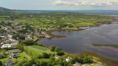 kinvara, galway, ireland, august 2020, drone flying high while slowly pushing towards fishing village