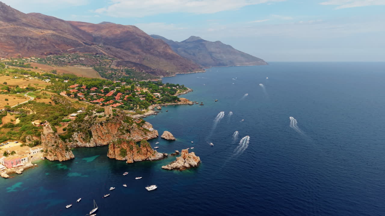 Mediterranean rocky coastline of Scopello at day time. Aerial view