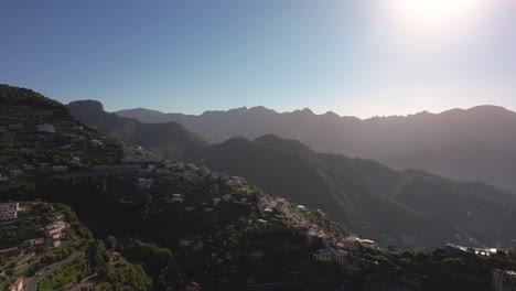 Drone-flying-in-circulair-motion-over-a-mountain-village-in-the-early-morning-on-the-Amalfi-coast-in-Italy-in-4k