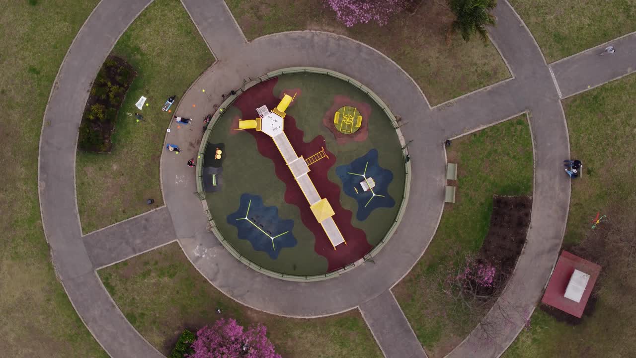 Aerial top down shot of round playground in Buenos Aires near park area,circle shot
