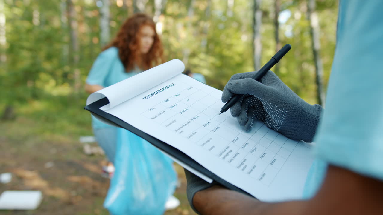 Volunteers Recording Tasks for Environmental Cleanup
