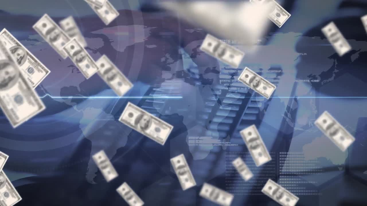 コンピュータキーボードの上に落ちるアメリカドル紙幣のアニメーション