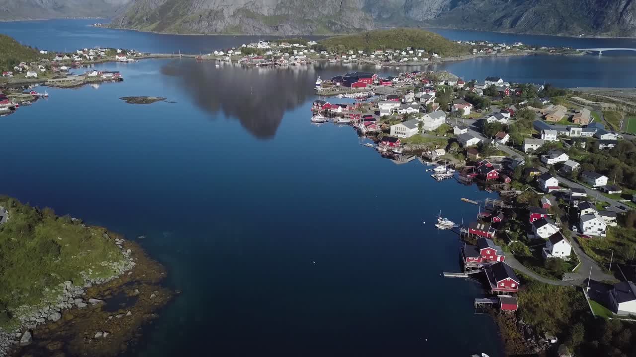 An aerial view of the town of Reine in Lofoten, Norway on a sunny day.
