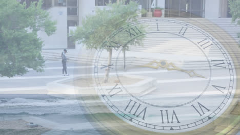 animation of clock rotating over aerial view of trees growing on city street by buildings