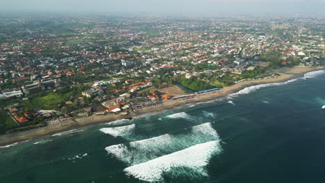 batu bolong beach and overpopulated dalung village under polluted air in bali