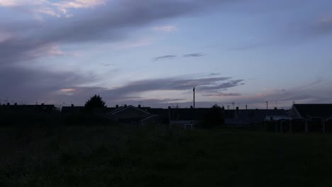 timelapse of clouds at sunset over urban neighborhood