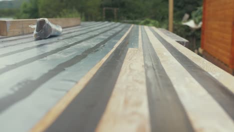 sealed cabin roof planking of old wooden boat with masking tape