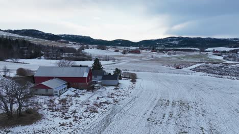 remote structures overlooking mountain ridges in winter season in norway