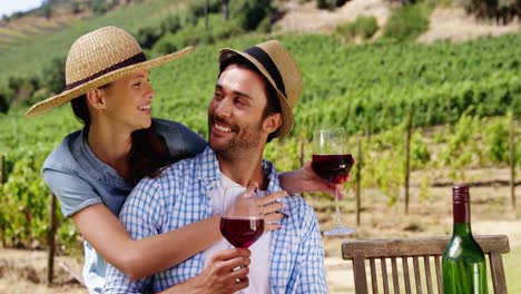 couple having wine in the farm