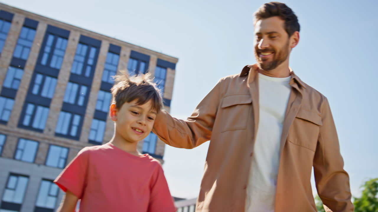 Small kid parent walking sunlight green zone closeup. Father pointing finger