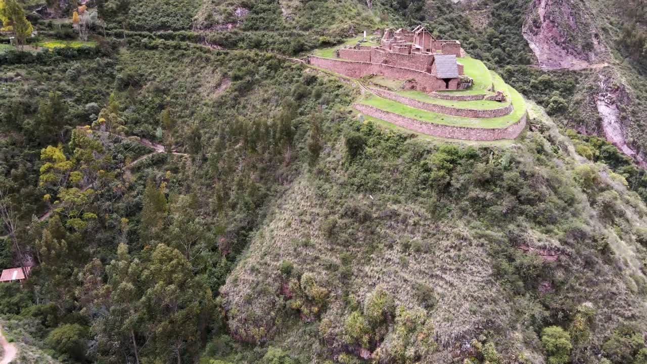Aerial over the ruins of Raqaypata in Urubamba, Sacred Valley, Cusco, Peru. Drone crane up