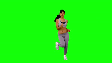 athletic woman jogging on green screen