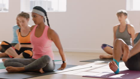yoga class group of young multiracial people practicing poses stretching body enjoying healthy lifestyle exercising in fitness studio