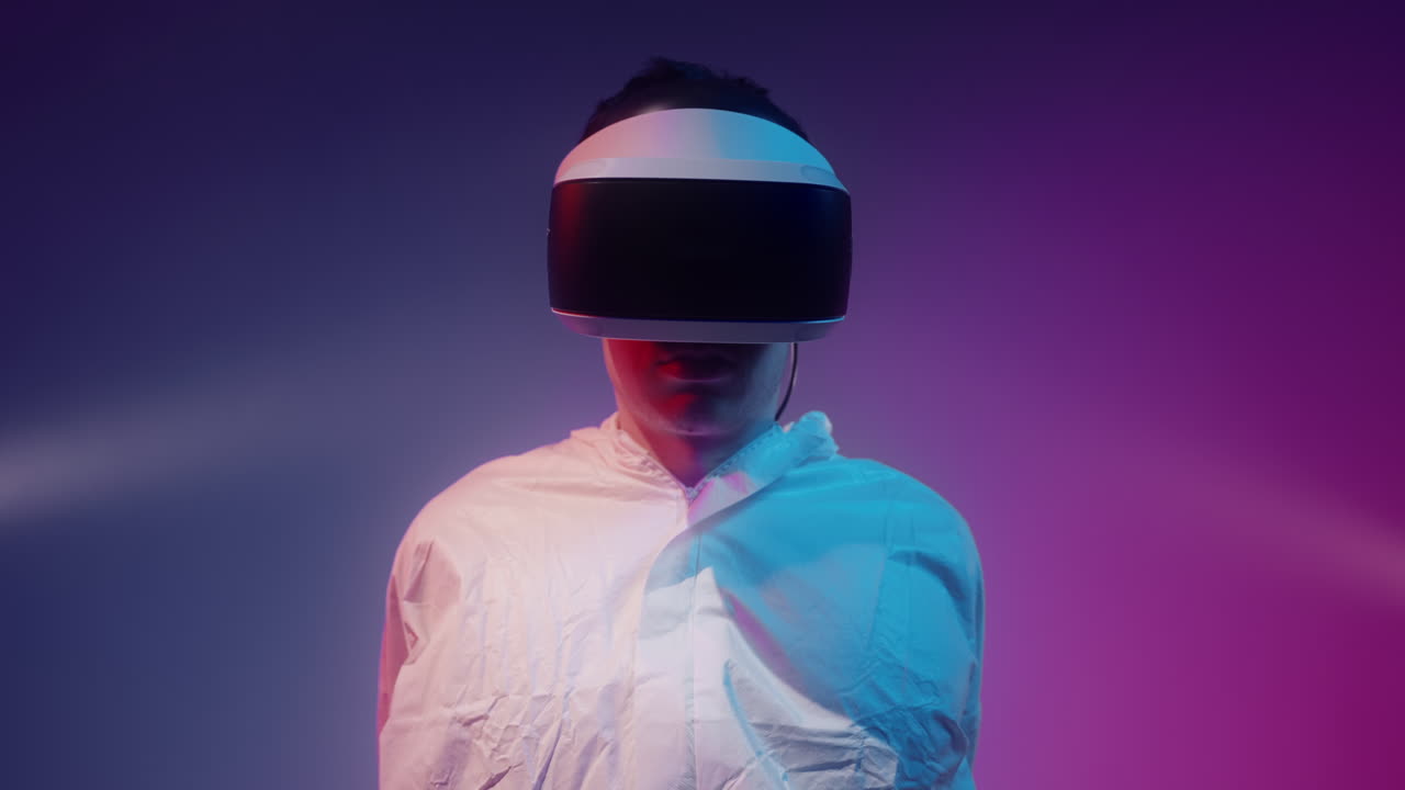 Person Wearing VR Headset in Neon Light