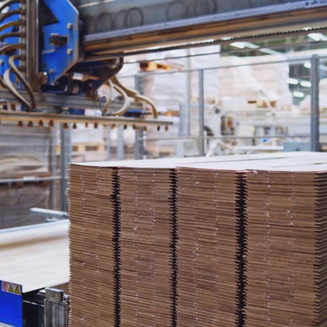 modernized woodworking manufacture. robotic equipment composing wooden panels inside the parquet floor factory.