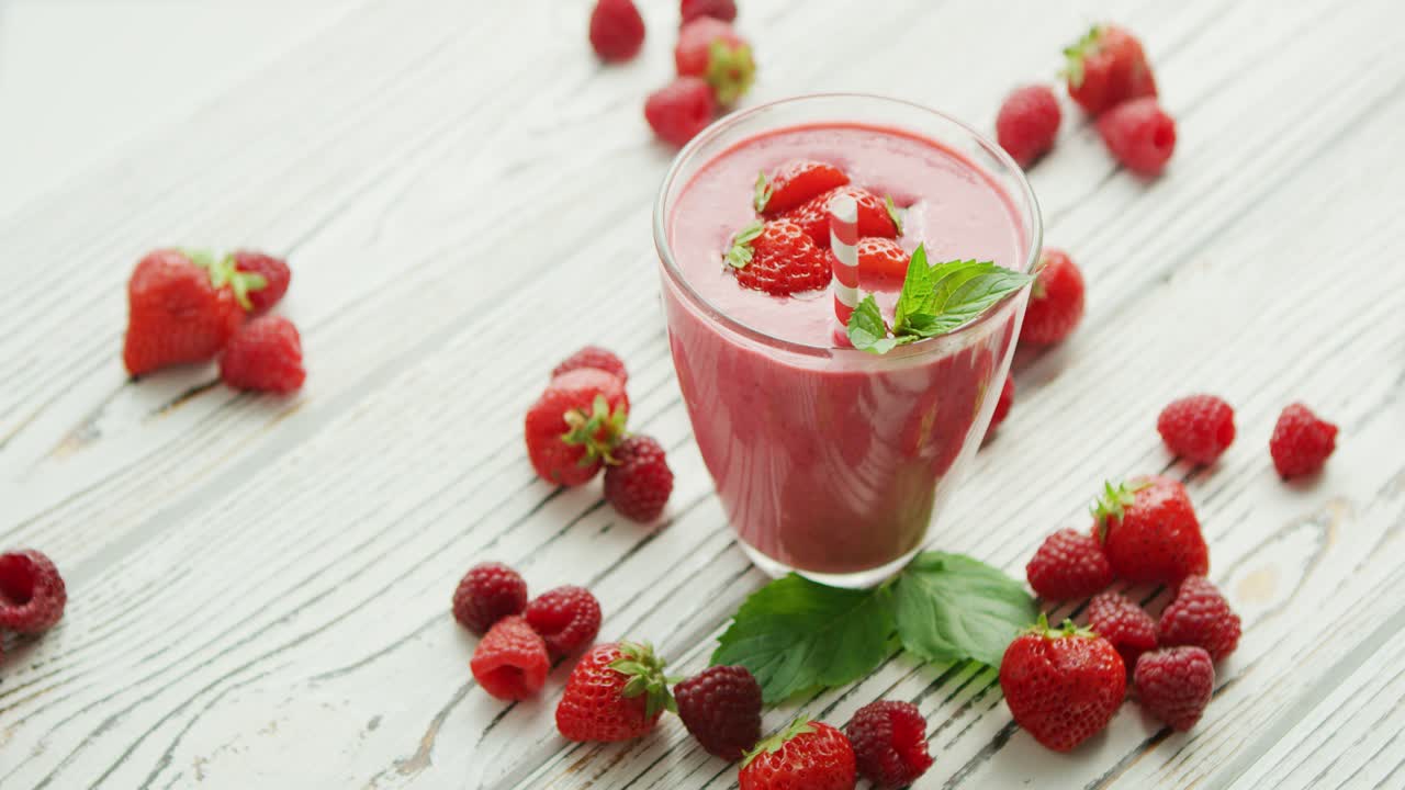 Strawberry smoothie in glass with mint