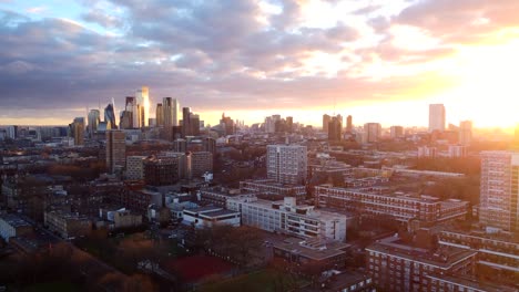 aerial view intense orange yellow sunset over east london city skyline