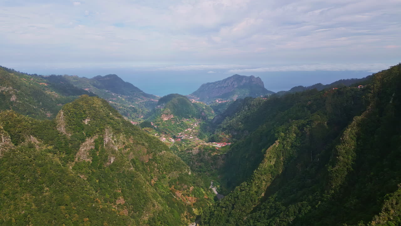 Lush greenery covering hillsides aerial view. Panoramic green majestic mountains
