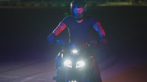 man on motorcycle at night