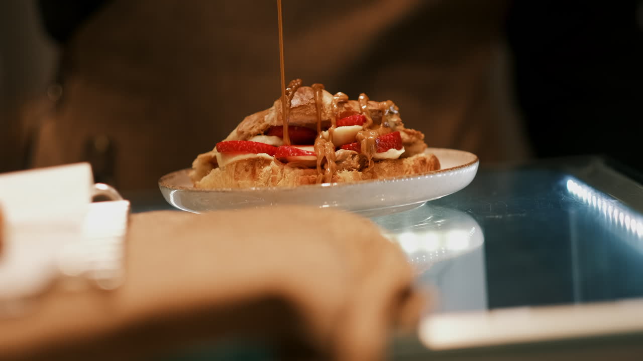 Sweet Harmony: Croissant Topped with Honey, Banana, and Strawberries