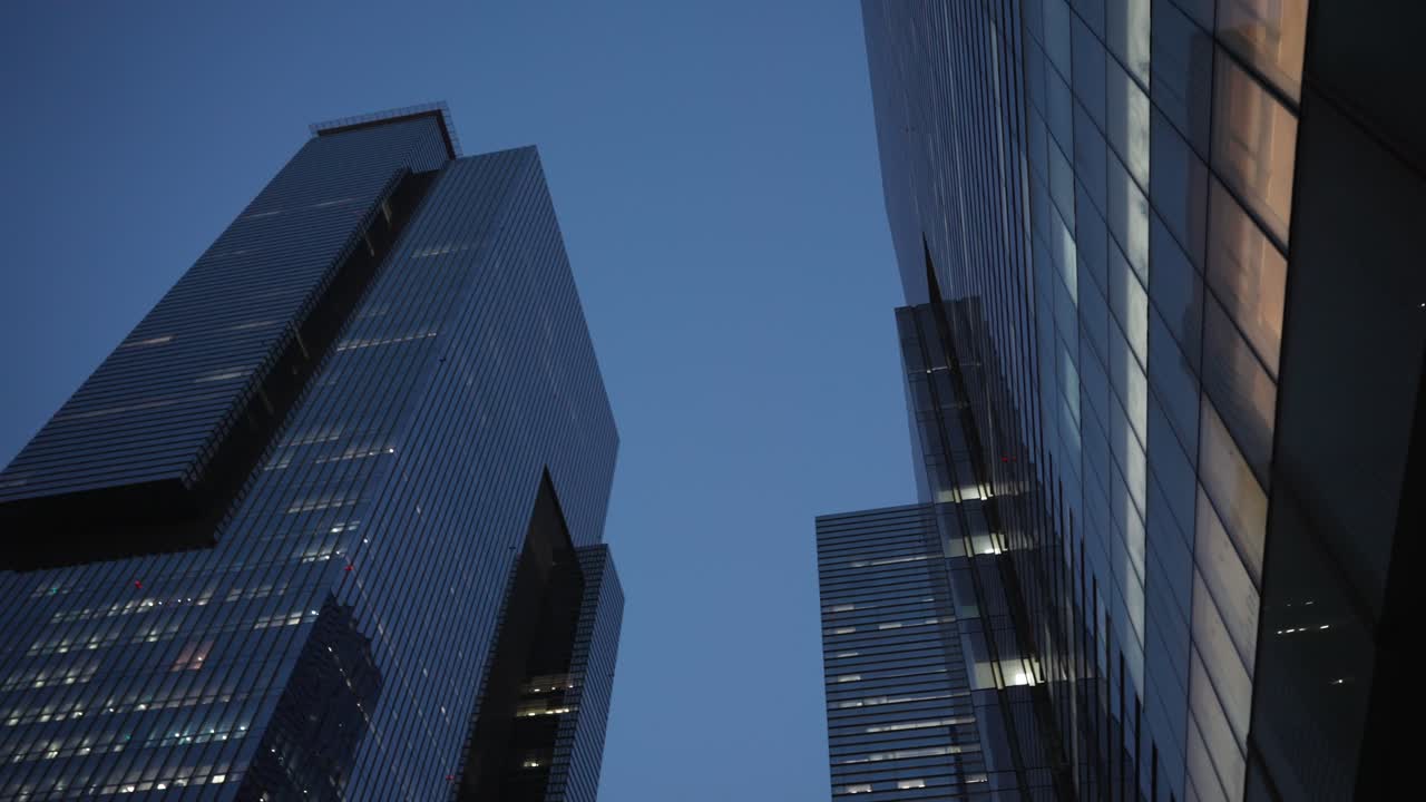 Twilight Hues Reflecting On Glass Exteriors Of Skyscrapers At Samsung Town In Seocho, Seoul, South Korea. low angle, panning shot