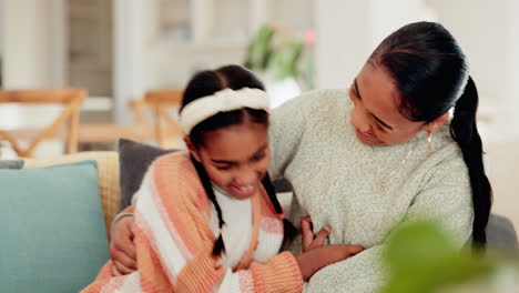 Happy,-tickle-and-mother-with-daughter-on-sofa