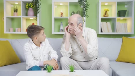 Elderly-grandfather-and-grandson.-Grandpa-is-chatting-with-his-grandson.