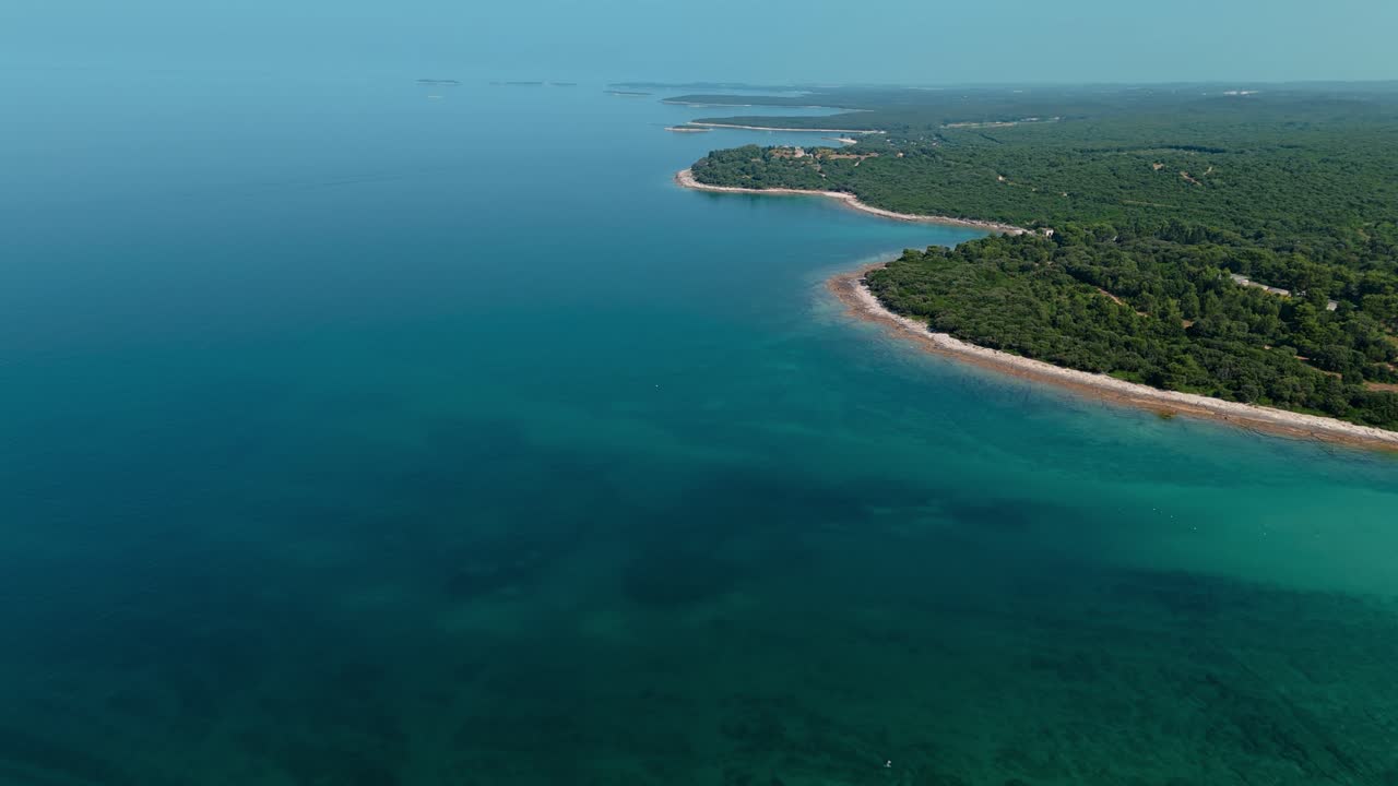 Aerial shot of Istrian coastline with turquoise Adriatic Sea close to Pula and Brijuni Islands
