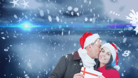 animación de una feliz pareja caucásica con sombreros de santa sobre un paisaje de invierno
