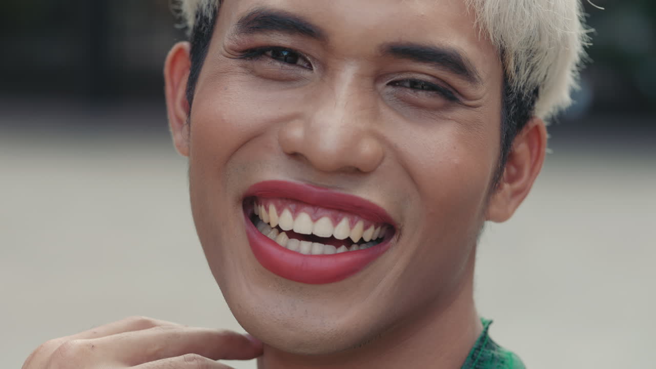 Smiling Person with Makeup and Short Hair