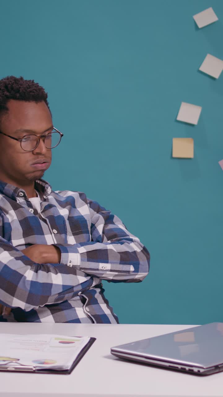 Man Working on Laptop at Desk
